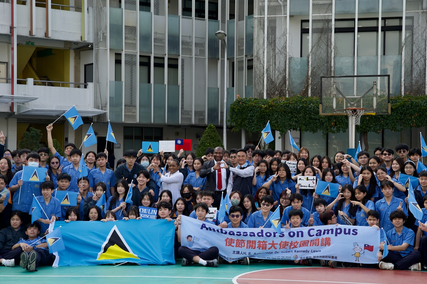 Lewis and his wife with teachers and students of Chu-Lin Private High School.